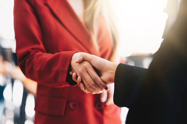 two businessman shake hands as hello in office closeup. Friend welcome, introduction, greet or thanks gesture, product advertisement, partnership approval, strike a bargain on deal concept - Foto, immagini