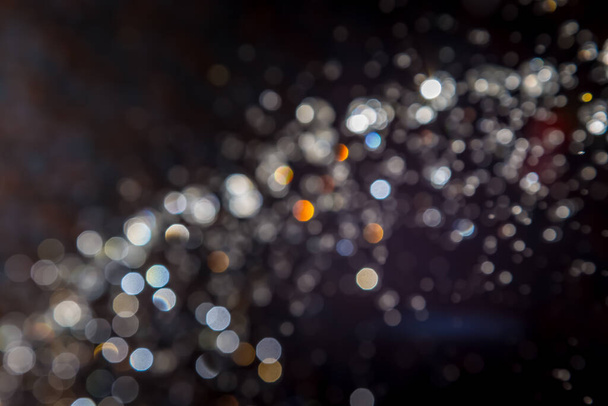 Colorful bokeh on black background - Foto, afbeelding