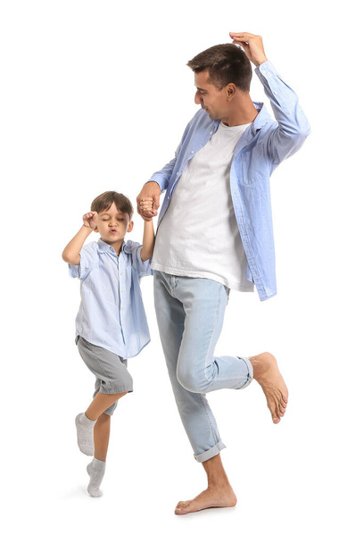 Dancing man and his little son on white background - Φωτογραφία, εικόνα