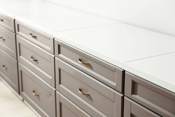 Modern kitchen drawers in light room - Foto, Imagen