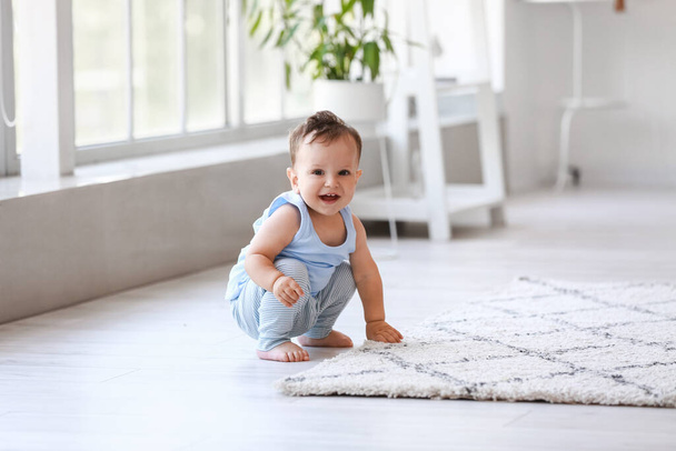 Little baby boy near carpet at home - Photo, Image