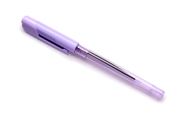 Lilac pen on white background - Фото, изображение