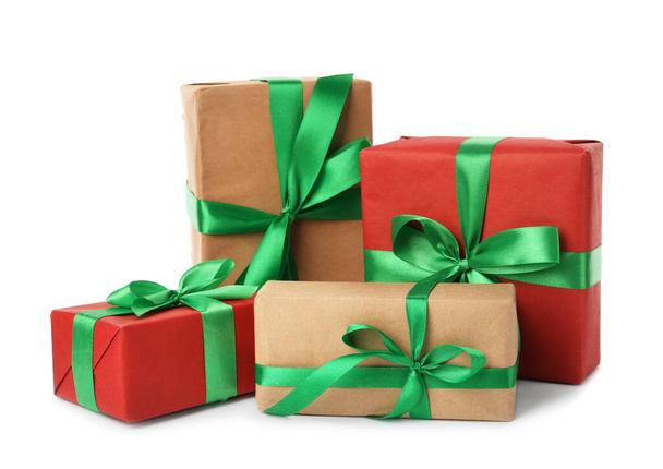 Different beautifully wrapped gift boxes on white background - Foto, Imagen