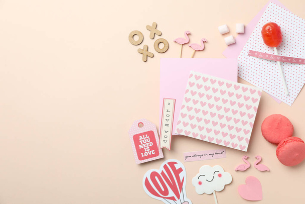 Valentine's Day accessories on beige background, space for text - Photo, Image