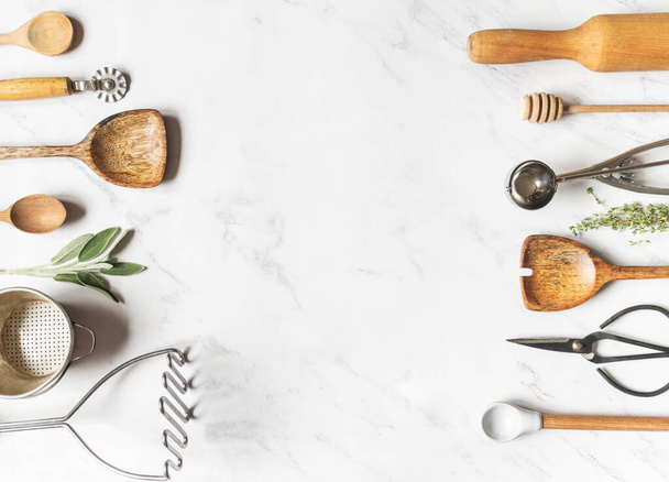 Flat lay various kitchen tools, fresh herbs and copy space for text. Top view. - 写真・画像