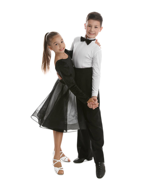 Beautifully dressed couple of kids dancing on white background - Foto, immagini