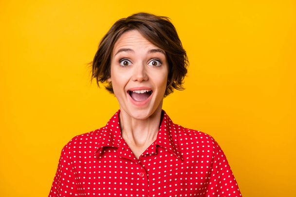 Photo of impressed nice brunette lady wear red shirt isolated on vivid yellow color background - 写真・画像