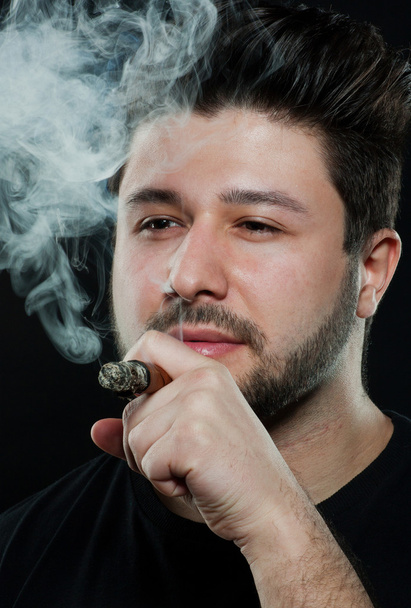Smoking cigar young man - Фото, зображення