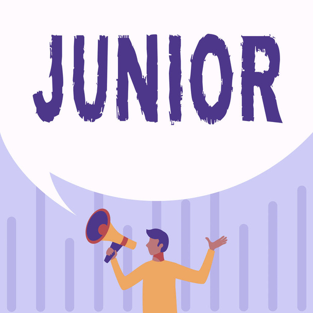 Handwriting text Junior. Word Written on erson who is a specified number of years younger than someone else Man Drawing Holding Megaphone With Big Speech Bubble Showing Message. - Photo, Image