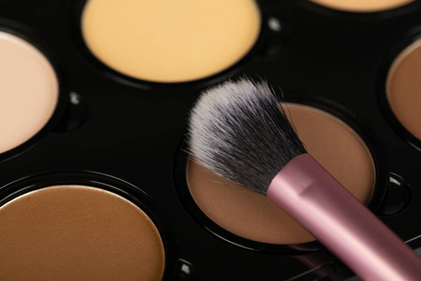 Close up picture of make up products and accessories, contour palette, brushes on white background - Fotografie, Obrázek