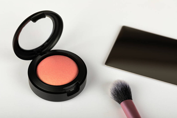 Picture of rose gold blush and makeup brush on white background - Fotoğraf, Görsel