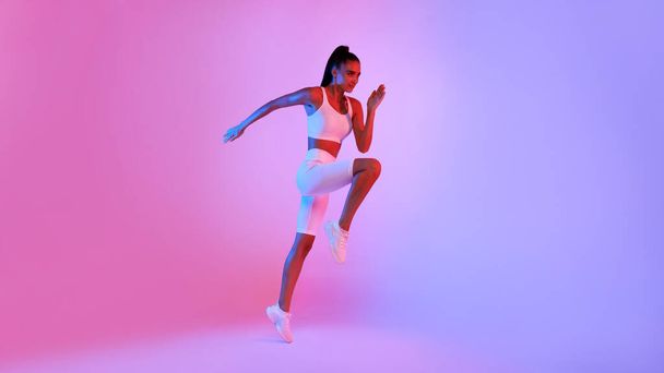 Sporty Woman Jumping Exercising Posing Over Neon Background, Panorama - Fotoğraf, Görsel