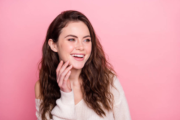 Portrait of pretty satisfied girl arm fingers on chin look empty space toothy smile isolated on pink color background - Valokuva, kuva