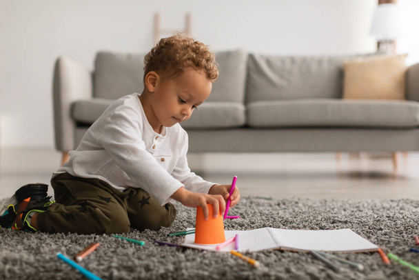 African American Little Boy Drawing Picture With Markers At Home - Photo, image