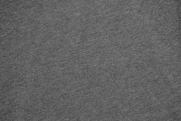 Texture of gray knitted fabric. Knitted fabric of machine knitting, flat surface without folds, close-up. - Photo, Image