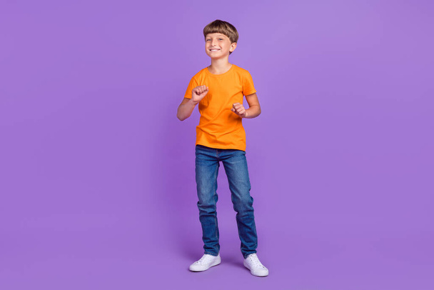 Full length body size photo boy in stylish outfit dancing happy isolated pastel purple color background - Foto, afbeelding