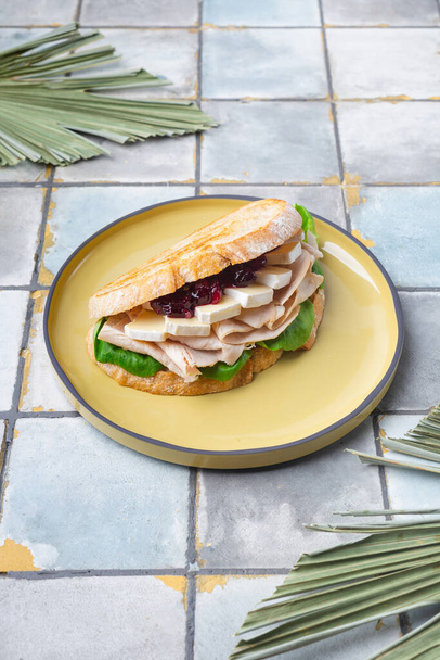 toast with spinach, French cheese Bri ham and jam on tile background - Valokuva, kuva