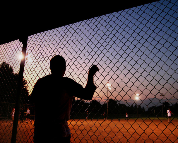 Baseball player in the dugout - Foto, afbeelding