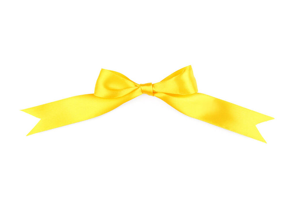 Bow made of yellow ribbon on white background - Photo, Image