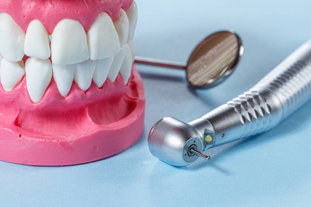 Dental instruments for teeth dental care on blue background - Photo, Image