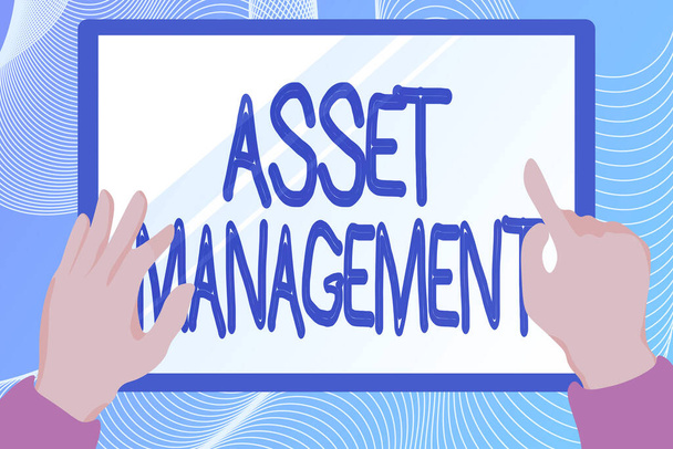 Inspiration showing sign Asset Management. Business idea systematic process of operating and disposing of assets Hands Illustration Holding Drawing On Tablet Scree Showing Information. - Photo, Image