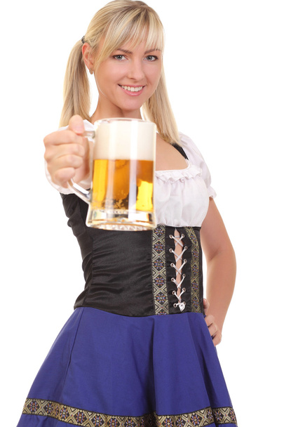 Young woman holding a beer - Фото, изображение