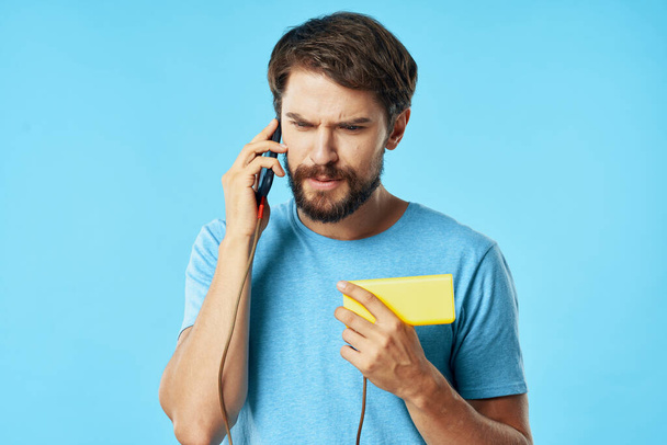 man talking on the phone internet lifestyle blue background - Foto, Imagen