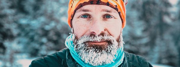 portrait of man face with frozen beard in harsh winter - Foto, Bild