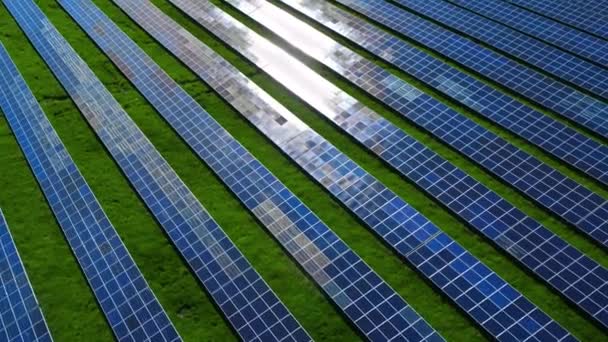 Drone view blue solar panels pattern on nature background. Photovoltaic panels. - Footage, Video