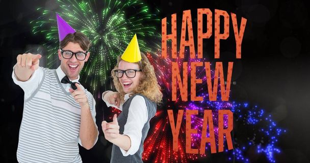 Digital composite image of happy young couple enjoying new year against firework. celebration, party and symbol. - Valokuva, kuva