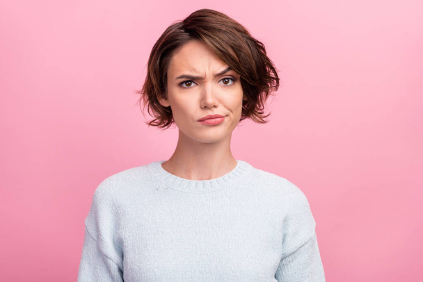 Photo of unhappy young woman bad mood irritated problem raise eyebrow isolated on pink color background - Foto, afbeelding
