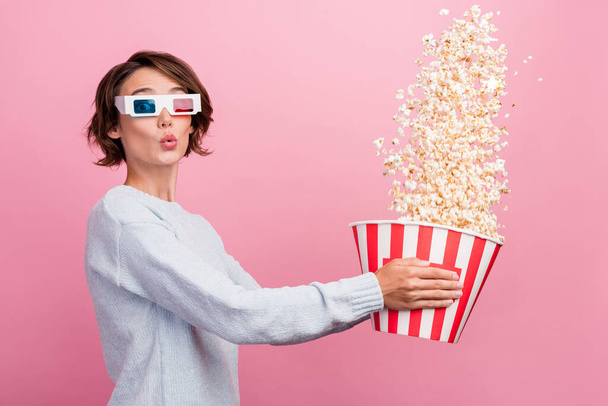 Photo of funky amazed positive happy young woman wear 3d glasses hold throw popcorn isolated on pink color background - Foto, Imagem