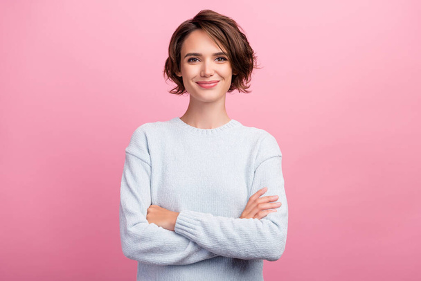 Photo of cute young brunette lady crossed arms wear blue sweater isolated on pink color background - Photo, Image