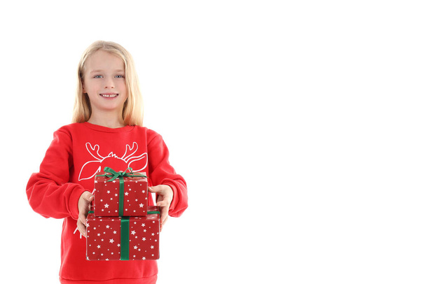 Little girl with Christmas boxes isolated on white background - Photo, Image