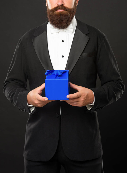 cropped bearded man in tuxedo hold present box, shopping - Foto, Imagem