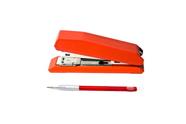 Красный степлер и ручка
 - Фото, изображение