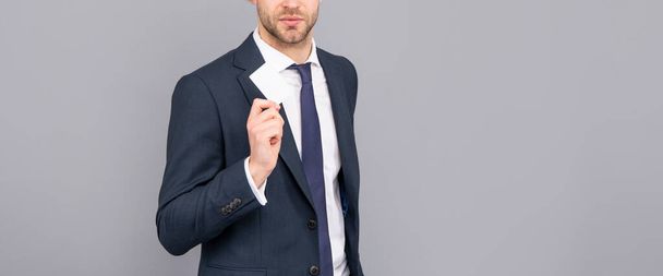 cropped man in jacket showing business card with copy space, contact us - Photo, Image