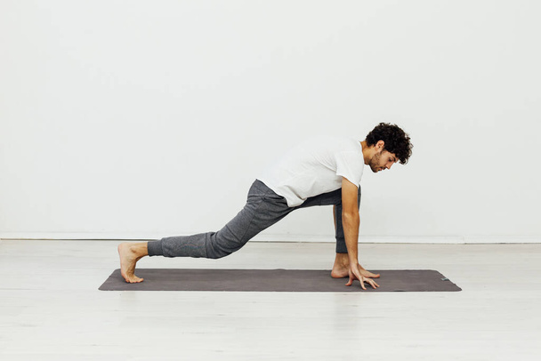 man engaged in fitness yoga asana gymnastics - Foto, Imagen