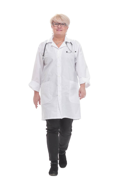 competent doctor in a white coat striding forward. - Фото, зображення