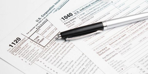 Pen on US TAX form Background. Tax Day concept - Photo, image