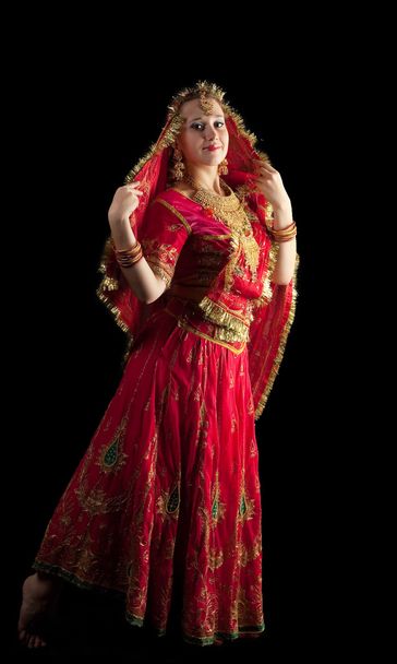 Young girl dance in red indian oriental costume - Fotoğraf, Görsel