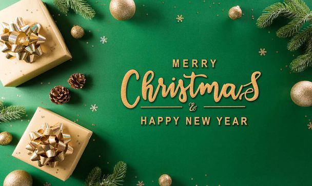 Christmas and new year background concept. Top view of Christmas gift box, christmas ball and snowflake on green background. - Photo, Image