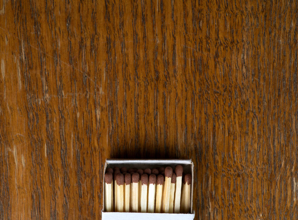 Boxes of matches on a wooden background top view. Closeup. - Zdjęcie, obraz