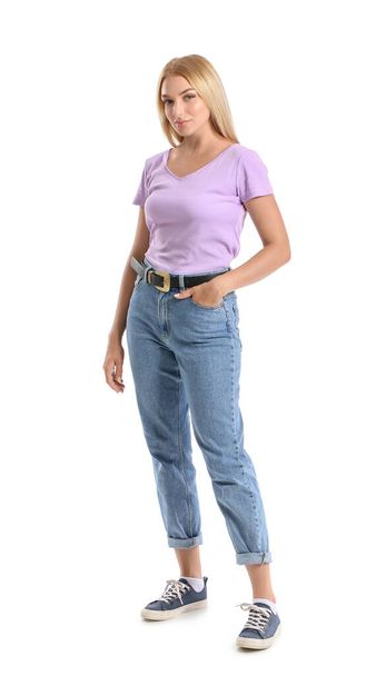Fashionable young woman in stylish jeans on white background - Foto, Imagem