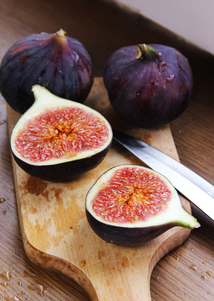 Beautiful ripe fresh pulpy figs on the table - Photo, Image