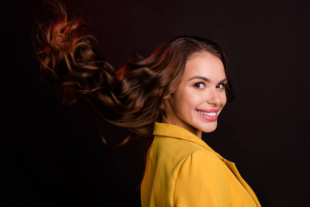 Profile photo of cool young brunette lady wear yellow jacket isolated on dark color background - Valokuva, kuva