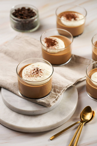Italian chocolate and coffee mousse dessert semifreddo - half-frozen ice cream with whipped cream and cocoa powder in small glasses - Фото, зображення