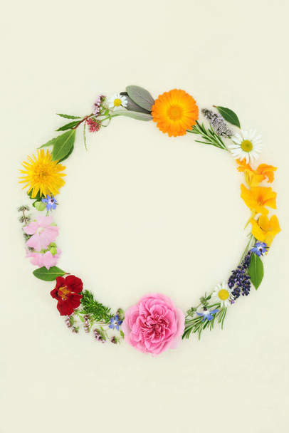 Summer wreath with herbs and flowers. Flora for naturopathic herbal plant medicine, seasoning and food decoration. On natural hemp paper background. Top view, flat lay, copy space. - Fotoğraf, Görsel