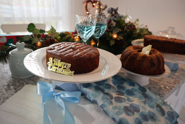 Fruit cake on a dining table decorated for festive occasion  - Foto, immagini