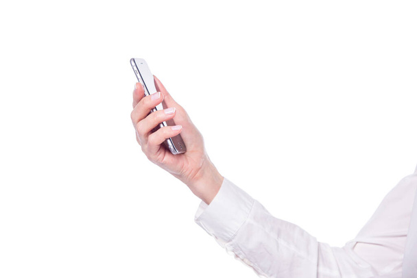 Close up of a senior woman hand holding modern smartphone isolated on white background - Φωτογραφία, εικόνα